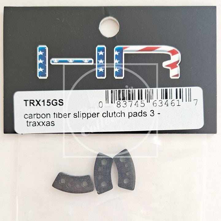 Carbon fiber slipper clutch pads with TRX15GS label on a clear background