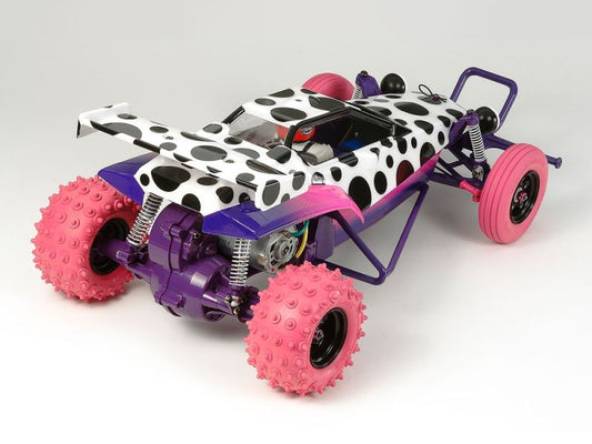 Toy car with polka dot body and pink wheels on a white background