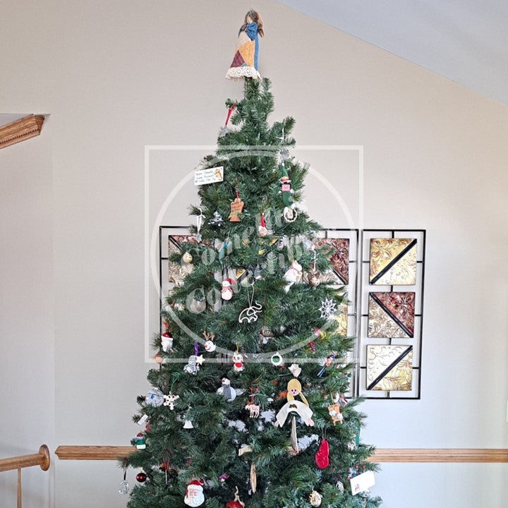 A decorated Christmas tree with Angel topper.
