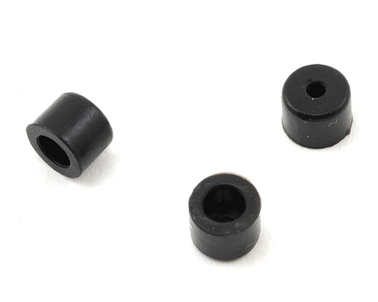Three small black cylindrical rubber bushings with hollow centers, shown on a plain white background.