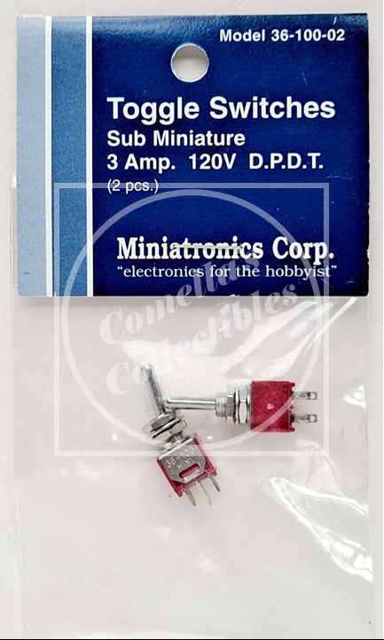Two miniature toggle switches in red and silver packaging with a blue header card labeled 'Miniatronics Corp. Toggle Switches Sub Miniature 3 Amp.