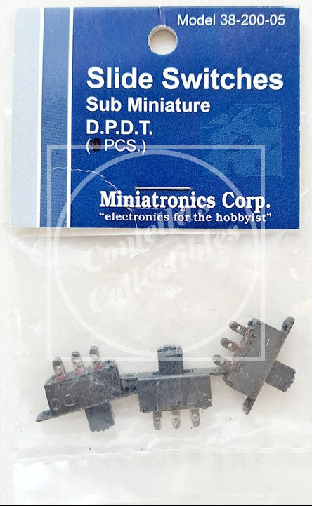 Three miniature black slide switches in sub-miniature D.P.