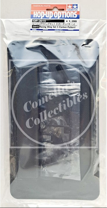 Model car part packaging with 'Comella's Collectibles' & Tamiya branding on a white background