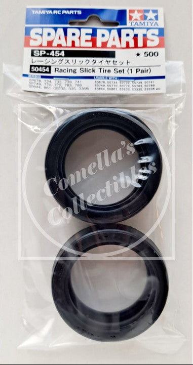 Tamiya RC spare parts packaging with two black tires in clear plastic on a white background.