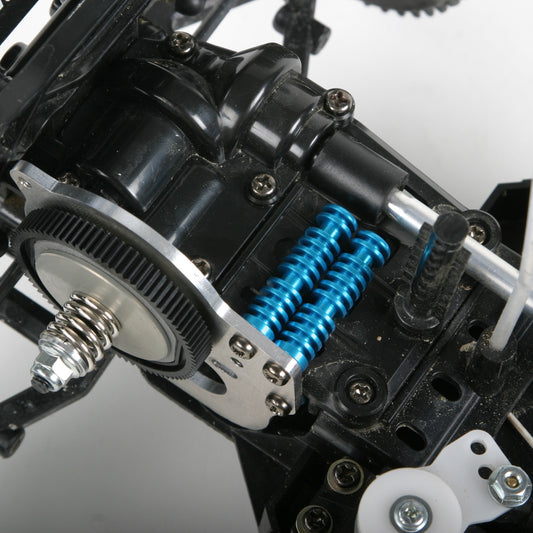 Close-up of mechanical components with blue springs on a white background