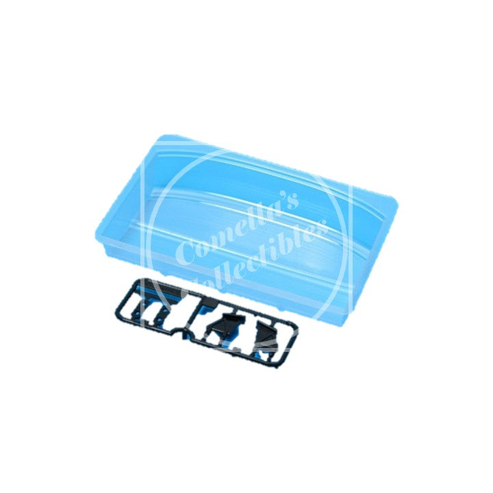 Clear plastic component with 'Comella's Collectibles' branding on a white background