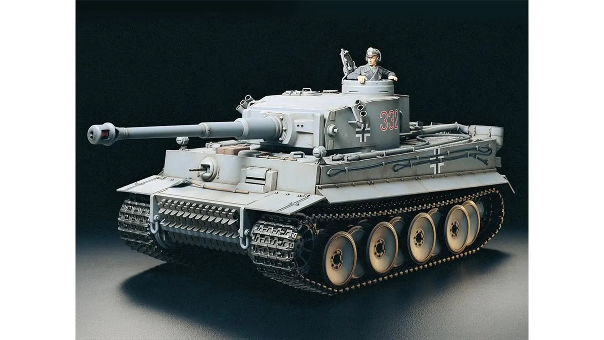 A 1:16 scale model of the German Tiger I tank by Tamiya, showing the completed assembly with realistic detailing and a crew figure on top.