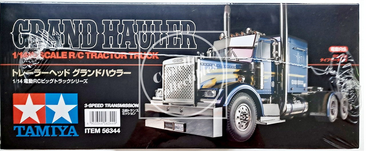 Model truck packaging for Tamiya Grand Hauler RC tractor truck on a black background