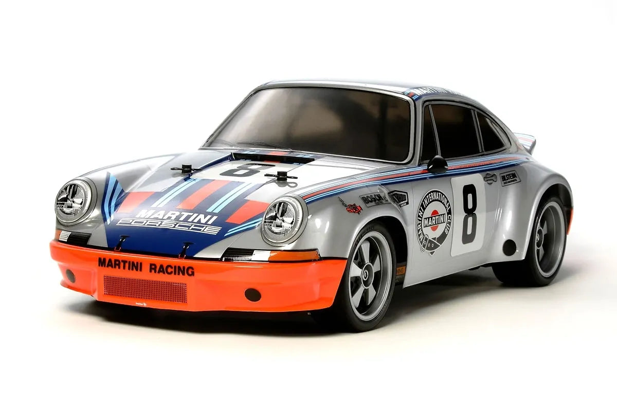 Tamiya 1/10 scale model kit of a Porsche 911 Carrera RSR race car, assembled and painted with Martini Racing decals.