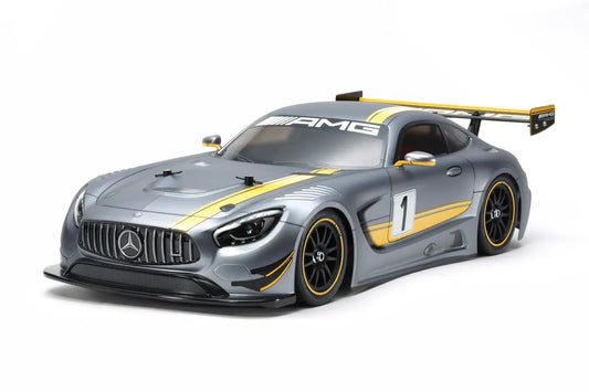 Unassembled Tamiya 1/10 scale model kit of a Mercedes-AMG GT3 4WD race car, including a TT-02 chassis, Mabuchi RS-540 motor, and brushed ESC.