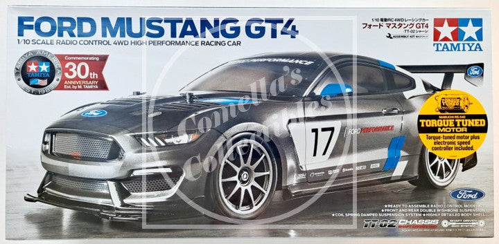 Boxed Tamiya Ford Mustang GT4 model car kit on a white background