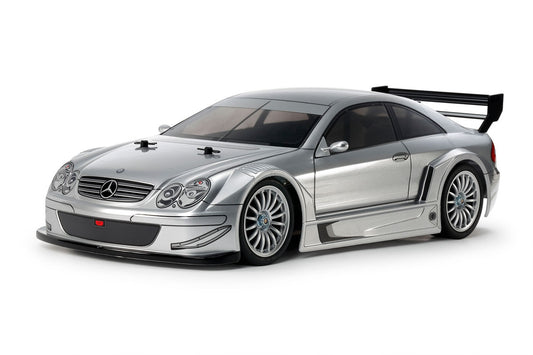 Silver model car with a large rear wing on a white background
