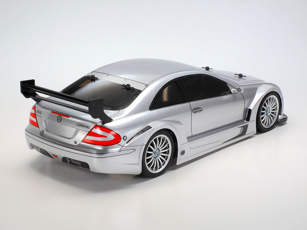 Silver car with a large rear wing on a white background