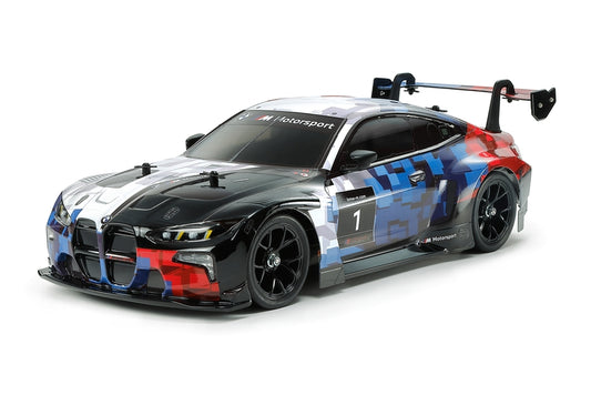 Model race car with colorful design on a white background
