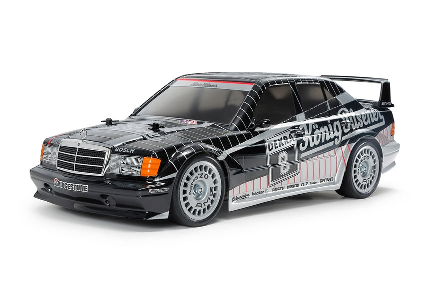 Tamiya model car with racing decals on a white background