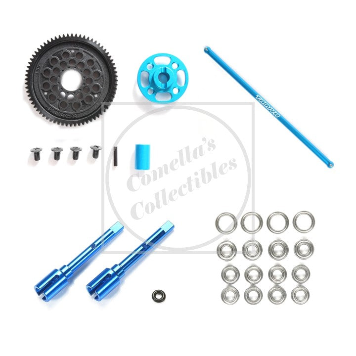 Collection of mechanical parts including gears and rods on a white background with 'Comella's Collectibles' branding.