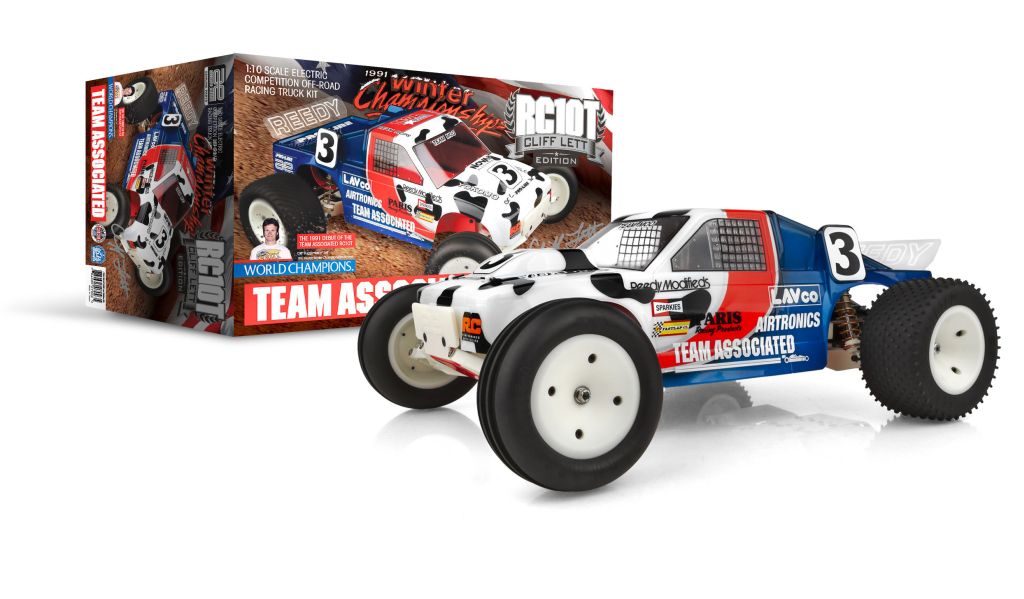 Model off-road buggy with 'Team Associated' branding next to its packaging on a white background