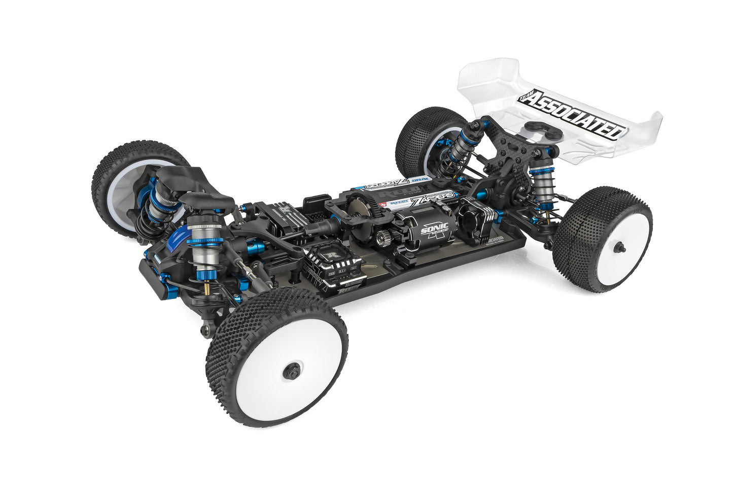 Unassembled RC car chassis with visible branding on a white background
