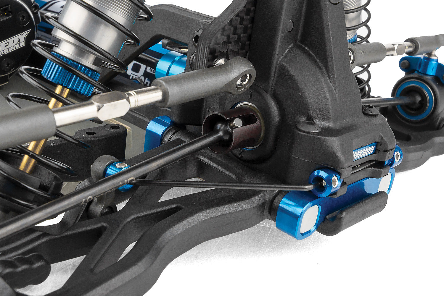 Close-up of a mechanical component with blue and black details on a white background