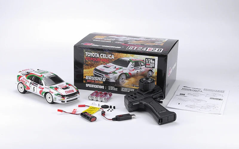Toyota Celica RC car kit with packaging, remote control, and accessories on a white background