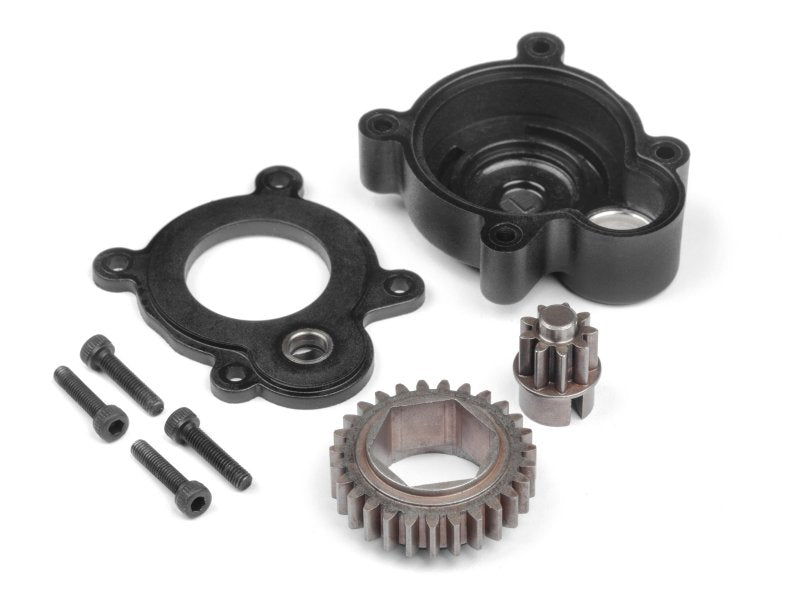 Mechanical components including gears and bearings on a white background