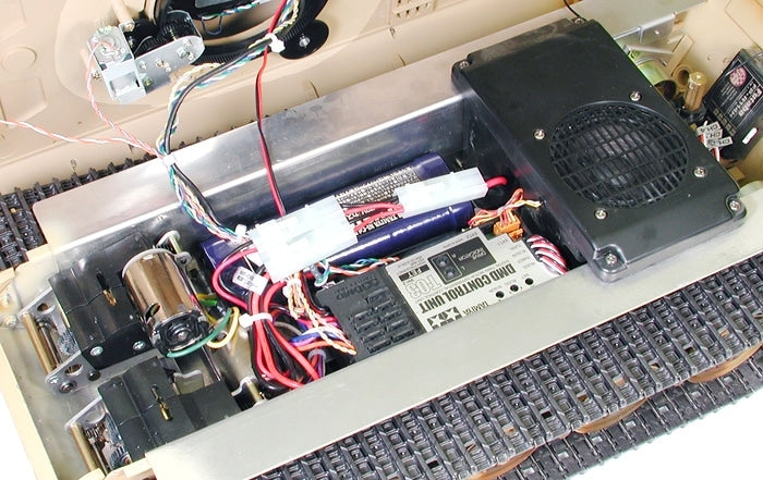 Close-up of electronic components inside a device with visible wiring and circuit board.
