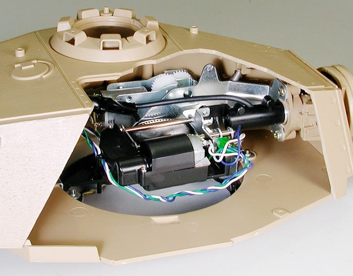 Close-up of a mechanical device with visible wiring and components on a gray background