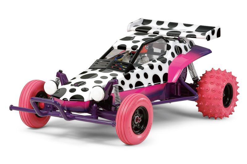 Toy car with polka dot design and pink wheels on a white background
