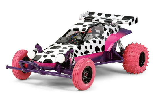 Toy car with polka dot design and pink wheels on a white background